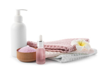 Spa composition with waffle towels and cosmetic products isolated on white