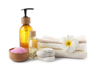 Spa composition with waffle towels and cosmetic products isolated on white