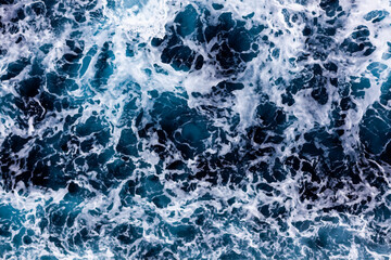 Ocean water surface texture. Aerial view of enchanting water with foam. Can be used in covers, packaging, posters, textures, cards, art and design projects. Stunning vector illustration.