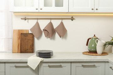 Clean waffle towels and plates on counter in kitchen
