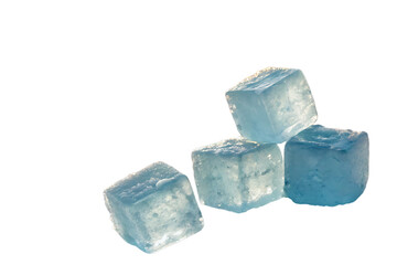 cluster pale blue ice cubes suspended soft white backdrop radiant warm natural light subtly blurred on AI generated by PNG