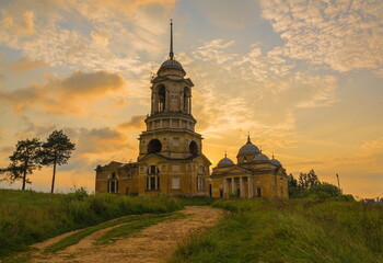 Ruins of an ancient bell tower and a sunset temple in Staritsa