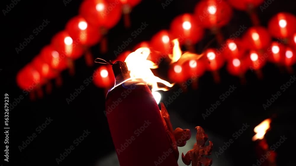 Aufkleber a red large incense stick is lit in front of a red lantern. the scene appears to be set during a cel