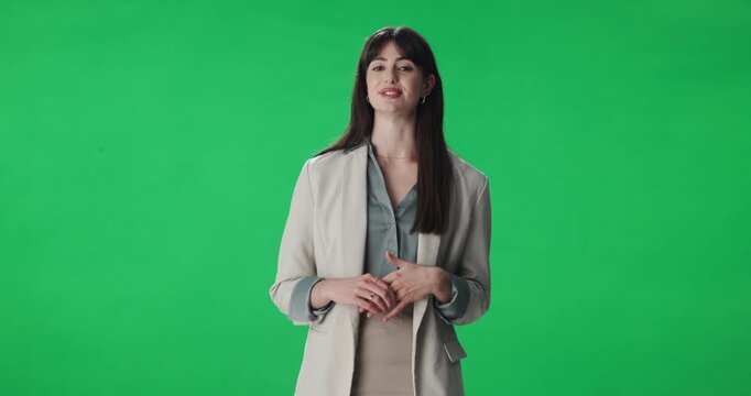 Presenter, woman and journalist by green screen for broadcast, live streaming or announcement. TV network, talking and portrait of female news reporter with media update or speech by chroma key.