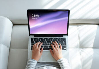 Laptop Screen Mockup with Hands Typing on Sofa