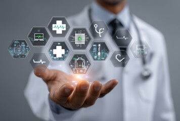 A male healthcare professional in a white coat gestures with his hand, displaying various digital health icons against a grey background, symbolizing modern medical technology.