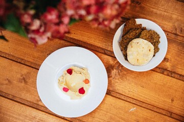 healthy food in freen lush garden hummus hoummus with flowers