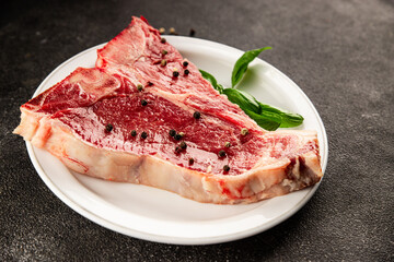 Raw steak T-bone fresh meat premium beef snack fresh delicious gourmet food background on the table...