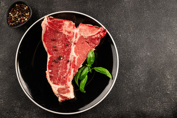 Raw steak T-bone fresh meat premium beef snack fresh delicious gourmet food background on the table rustic food top view copy space