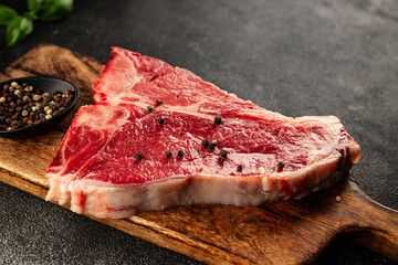 Raw steak T-bone fresh meat premium beef snack fresh delicious gourmet food background on the table...