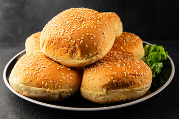 Bun burger puffy soft buns baking fresh delicious gourmet food background on the table rustic food top view copy space