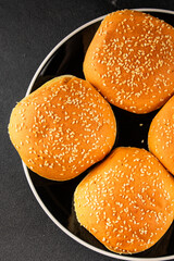 Bun burger puffy soft buns baking fresh delicious gourmet food background on the table rustic food...