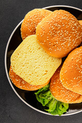Bun burger puffy soft buns baking fresh delicious gourmet food background on the table rustic food top view copy space