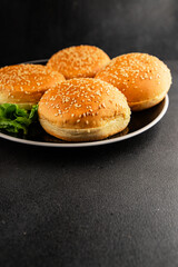 Bun burger puffy soft buns baking fresh delicious gourmet food background on the table rustic food top view copy space
