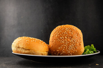 Bun burger puffy soft buns baking fresh delicious gourmet food background on the table rustic food top view copy space