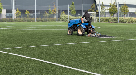  soccer field and worker in field © Angelov