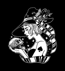 Beautiful witch holding human skull in hands