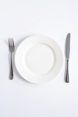 White plate setting with fork and knife elegant dining minimalist flat lay food