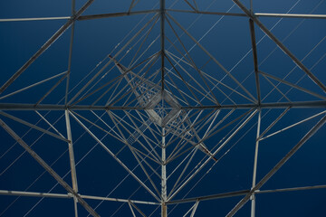 Underneath a Frosted Power Tower on a Clear Day