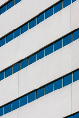 Close up image of office building with tinted windows.