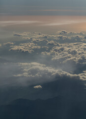 A bird's-eye view of the sunset over the Mediterranean Sea. Aerial photography. View from the airplane window. We look at the clouds from above.