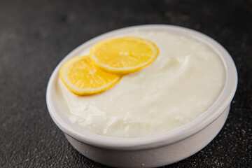 Lemon yogurt natural product skyr sour milk skir fresh delicious gourmet food background on the table rustic food top view copy space keto and paleo diet vegetarian food