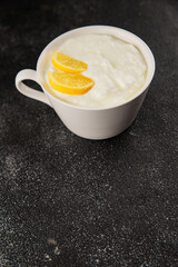 Lemon yogurt natural product skyr sour milk skir fresh delicious gourmet food background on the table rustic food top view copy space keto and paleo diet vegetarian food