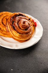 Raisin bun sweet pastry dessert puff pastry fresh delicious gourmet food background on the table rustic food top view copy space