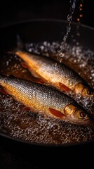 Crispy whole river crucian carp frying in golden oil in a rustic kitchen