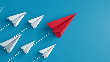 Red paper airplane leading white ones on blue background