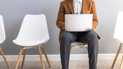 Business Professional Working on Laptop in Minimalist Office Setting
