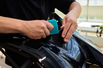 Applying a Protective Film on the Surface of Your Car for Enhanced Durability and Shine