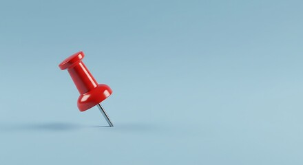 Red Push Pin on Light Blue Background Close Up