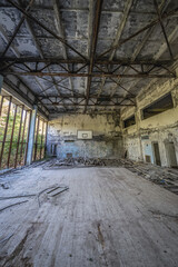 Basketball court in building of Azure Swimming Pool in Pripyat ghost city in Chernobyl Exclusion Zone, Ukraine