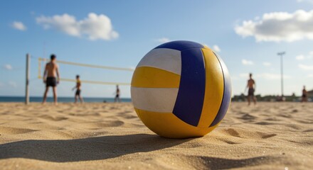 Beach volleyball game in progress, ball in foreground, players on sandy court.