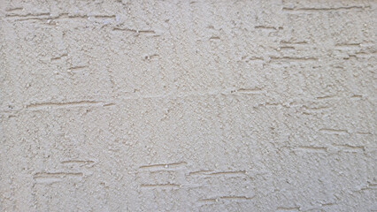 Close-Up of Rough Textured Plastered Wall in Neutral Beige Tone