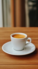 Obraz premium Delicate espresso cup cradled on a wooden table, radiating warmth and inviting moments of reflection over a steaming brew