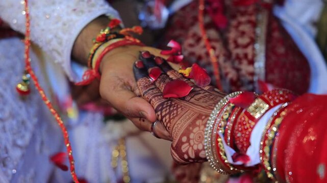 Authentic scene of a traditional Indian marriage vidhi, capturing sacred rituals performed around the holy fire (Agni) under a decorated mandap