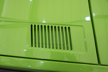 Close-Up of Green Classic Car Body Vent Detail © DRBURHAN