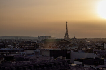 Eiffel Tower Silhouette at Sunset Over Rooftops of Paris