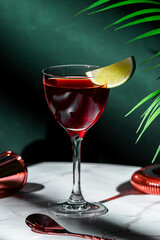 Irish Jack Rose alcoholic cocktail drink with Irish whiskey, calvados, lime juice, grenadine and lime slice