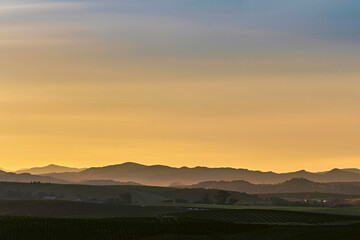 Yellow sunrise, sunset over horizon