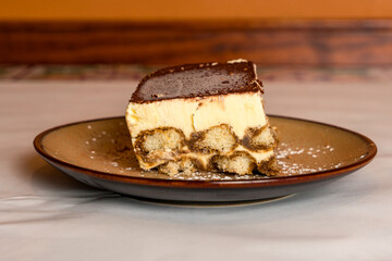 One slice of tiramisu on a plate