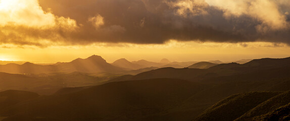 Panorama of mountains, hills at sunrise, sunset