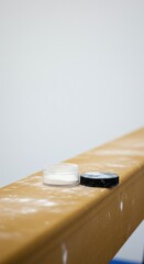 Gymnastic beam with powder