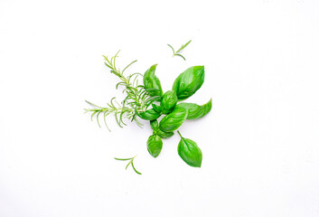 Food, spices and spicy herbs background, top view. Fresh rosemary and basil on white table