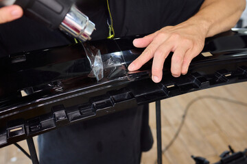 Applying a Protective Film on the Surface of Your Car for Enhanced Durability and Shine