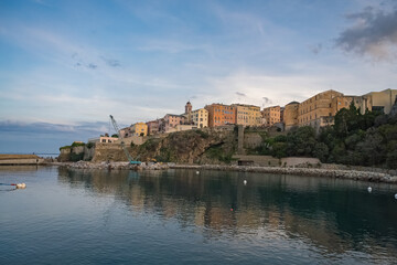 Obraz premium Corsica, Bastia, typical houses in the harbor in summer, sunset 