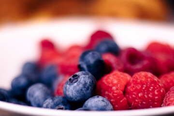 Fresh Raspberries and Blueberries in a White Bowl – Healthy Summer Fruits