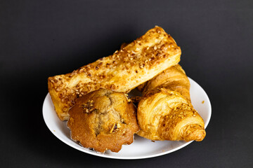 Flaky Croissant with Fresh Berries and Banana on Vibrant Yellow